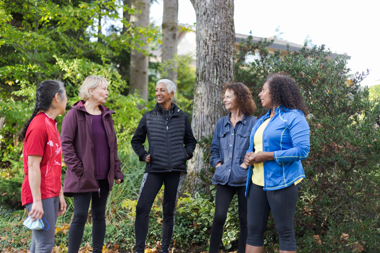 Five older women on a walk outside