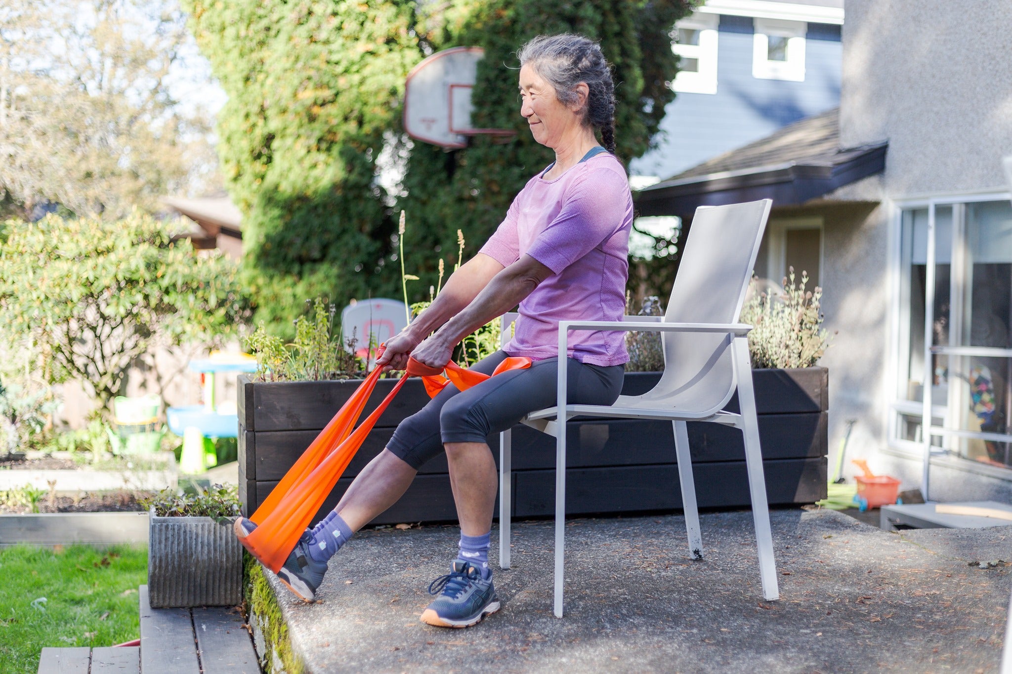 Older Woman using Exercise Band for Lower Body