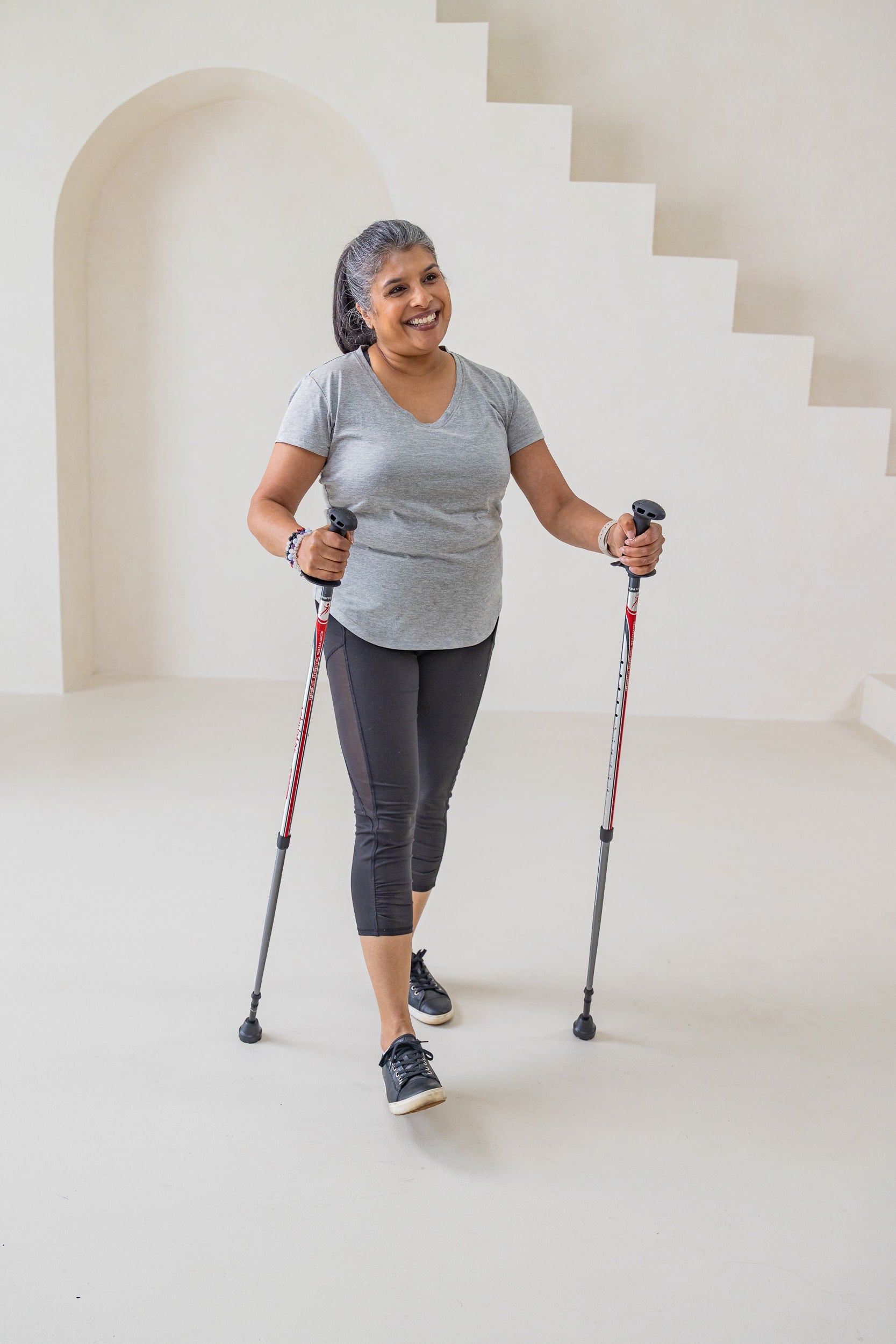 Women using urban poles for wokout